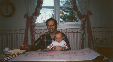 Mike reviewing plans with a young Luke